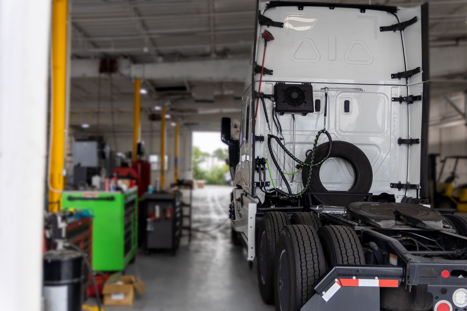 White Semi Truck Parked In Repair Station.